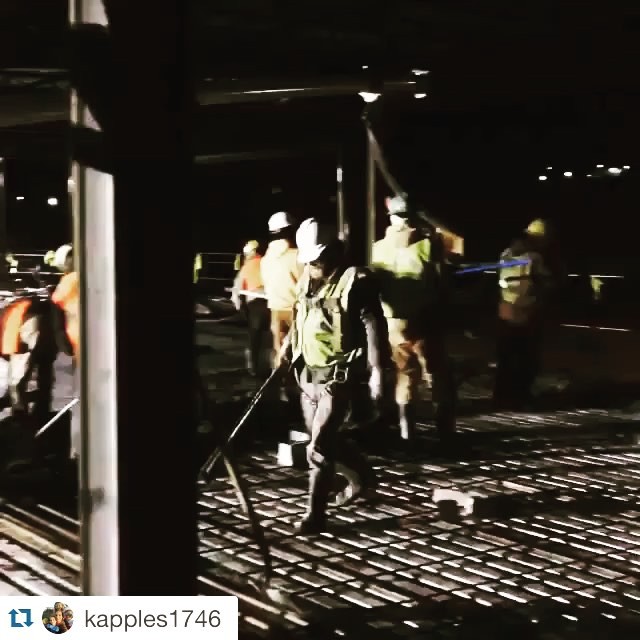 Workers pouring indoor slab with the line pump