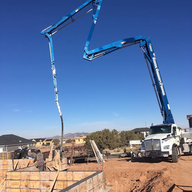 Truck pouring another foundation wall