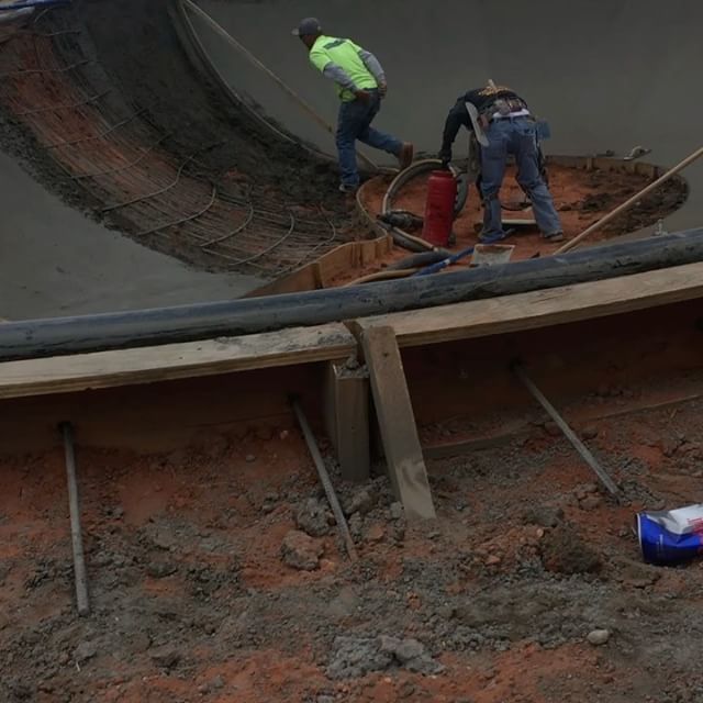 Workers blasting shotcrete for skate park walls